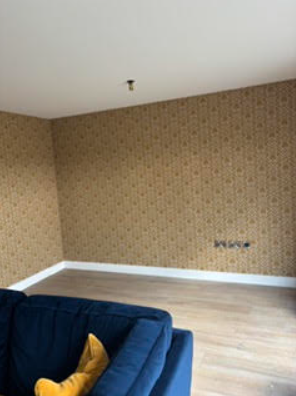 Room with patterned wallpaper before decorating