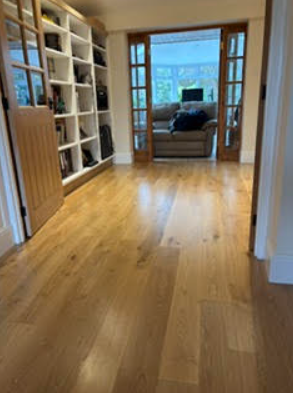 Modern hallway with wooden flooring and built-in shelving