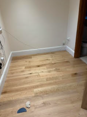 Room with wooden flooring before decorating